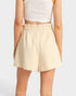 Beige skirt worn by a person on a white background