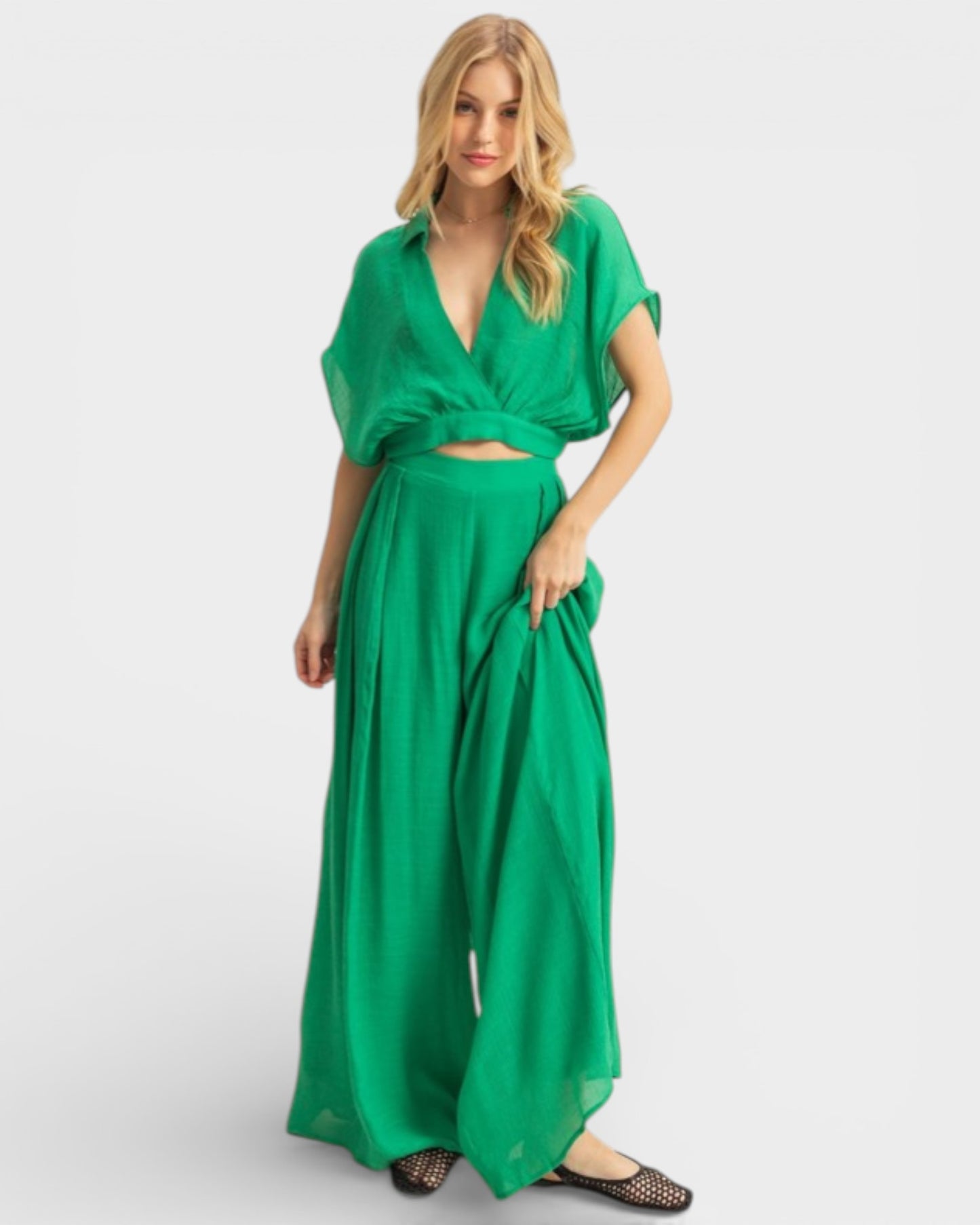 Woman wearing a green dress on a white background