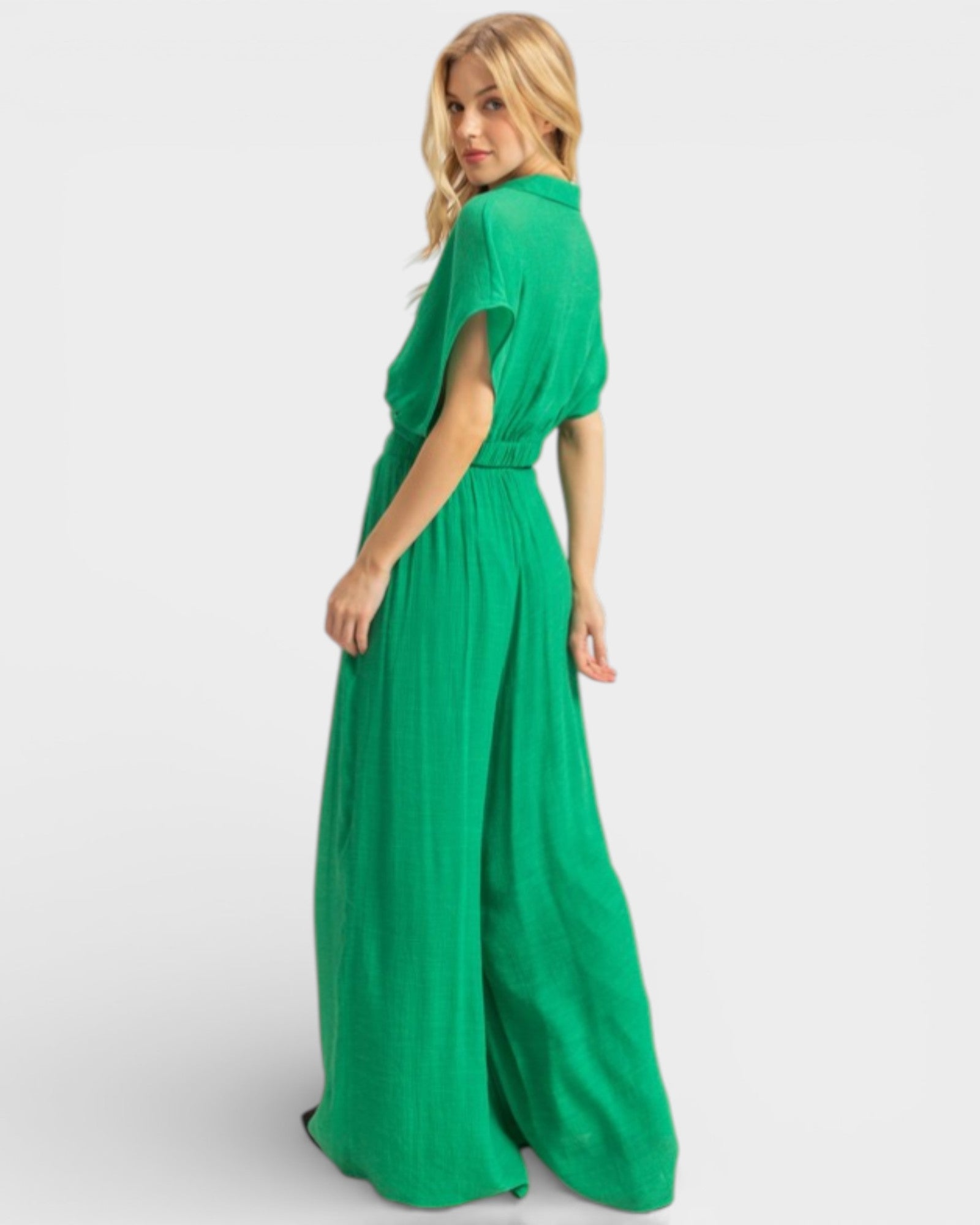 Woman wearing a green dress on a white background