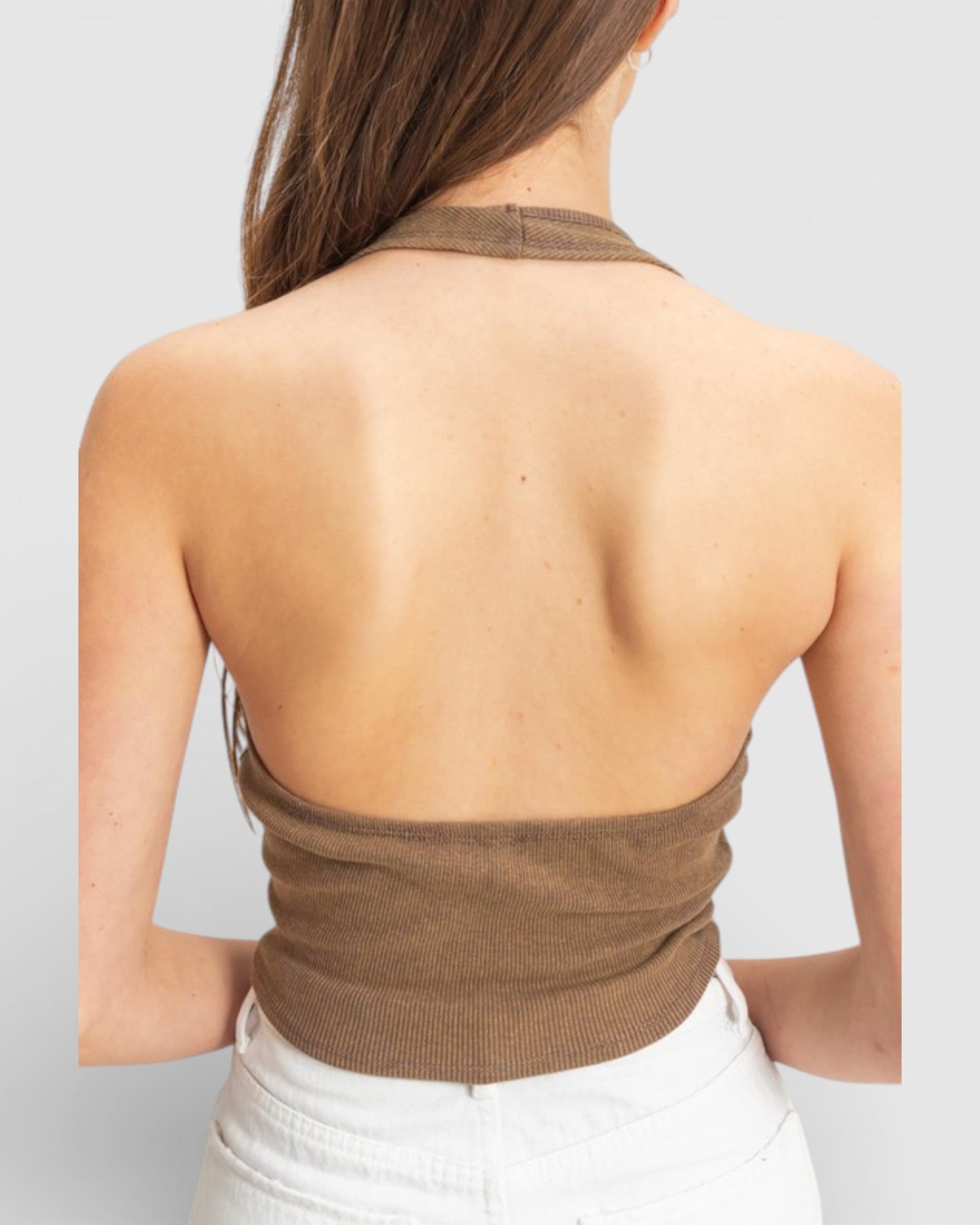 Brown halter top worn by a person on a plain background