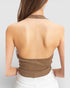 Brown halter top worn by a person on a plain background