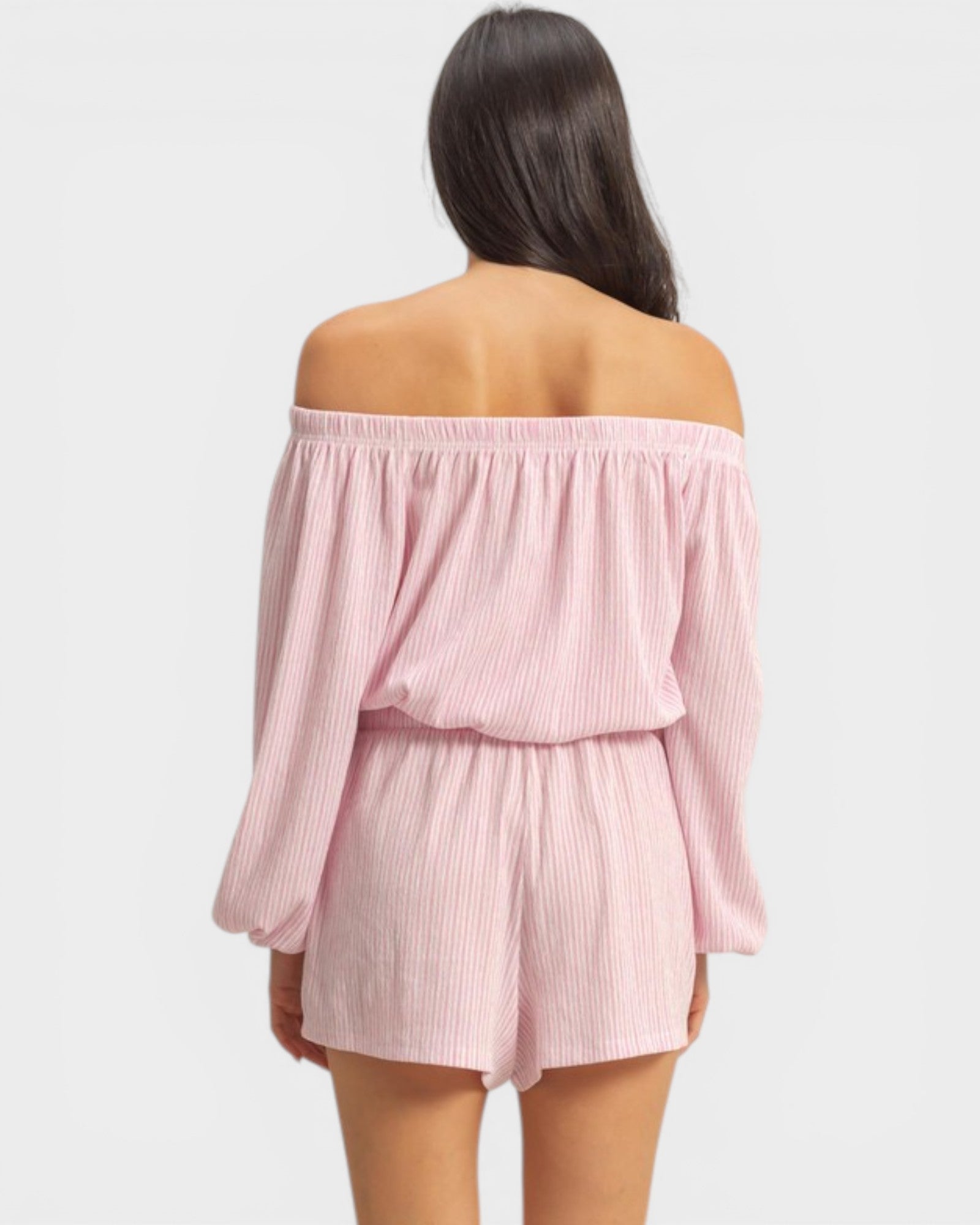Pink off-shoulder top and shorts set on a white background