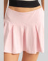 Pink skirt worn by a person on a gray background