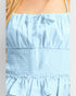 Light blue dress with smocked bodice and ruffled hem