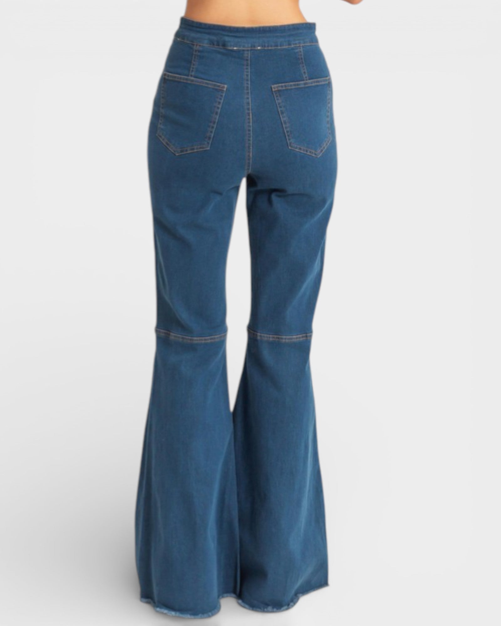 Blue bell-bottom jeans on a white background