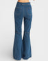 Blue bell-bottom jeans on a white background