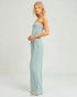 Woman wearing a light blue strapless gown on a white background