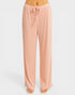 Pink ribbed lounge pants on a white background