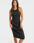 Woman wearing a black sleeveless dress on a white background