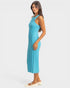Woman wearing a blue ribbed dress on a white background