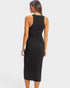 Black ribbed dress worn by a model on a white background