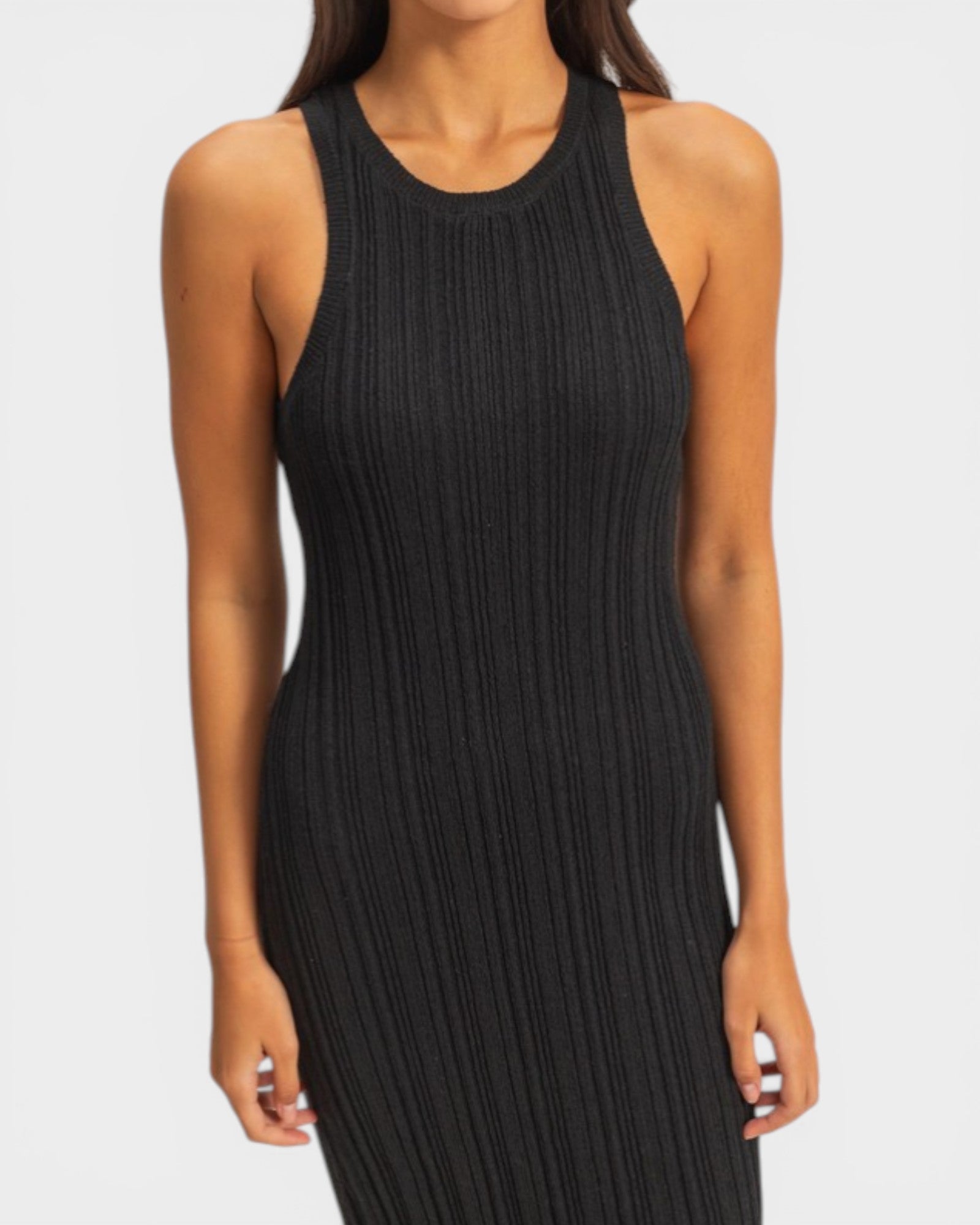 Black ribbed sleeveless dress worn by a model on a white background