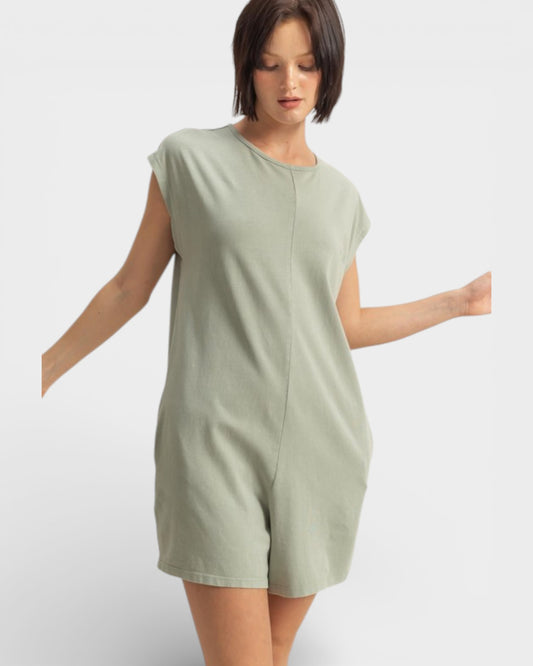 Woman wearing a light green dress on a white background