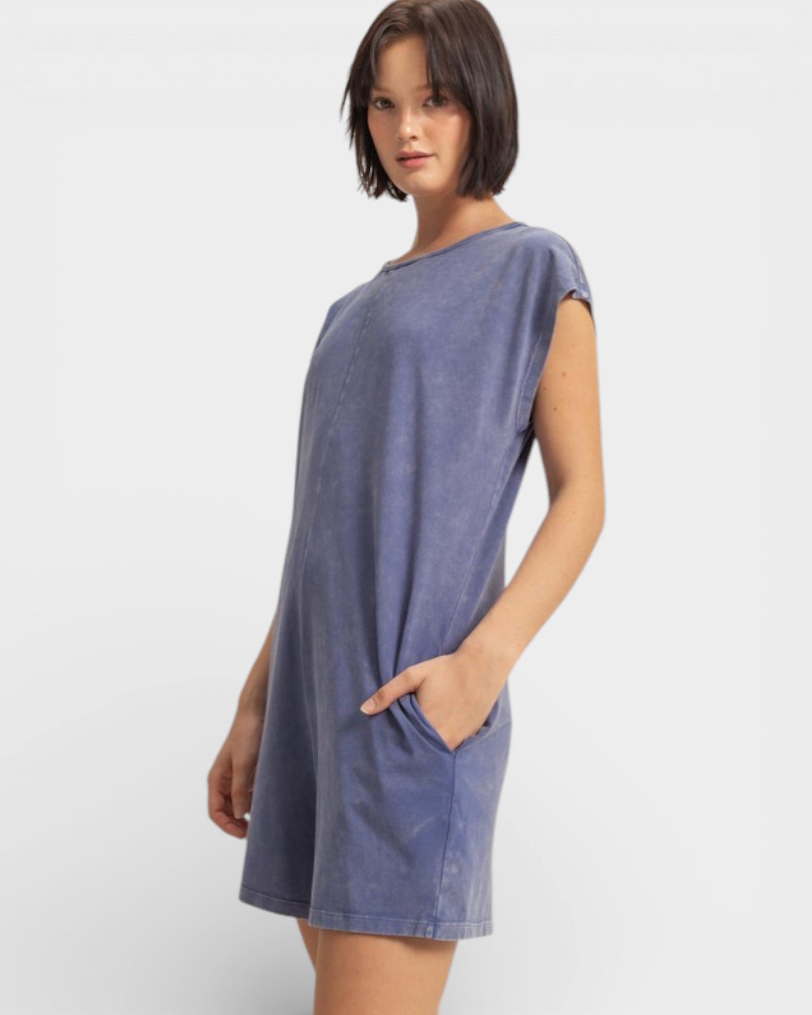 Woman wearing a blue dress on a white background