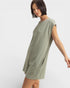 Woman wearing a green dress on a white background