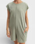 Person wearing a green dress on a white background