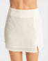 White skirt worn by a person on a white background