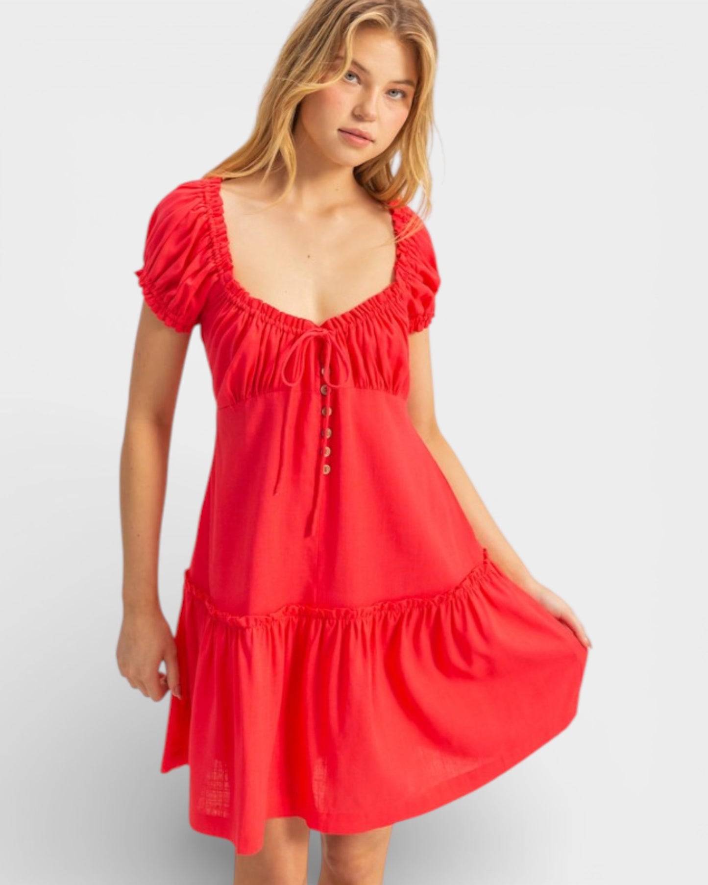 Woman wearing a red dress on a white background