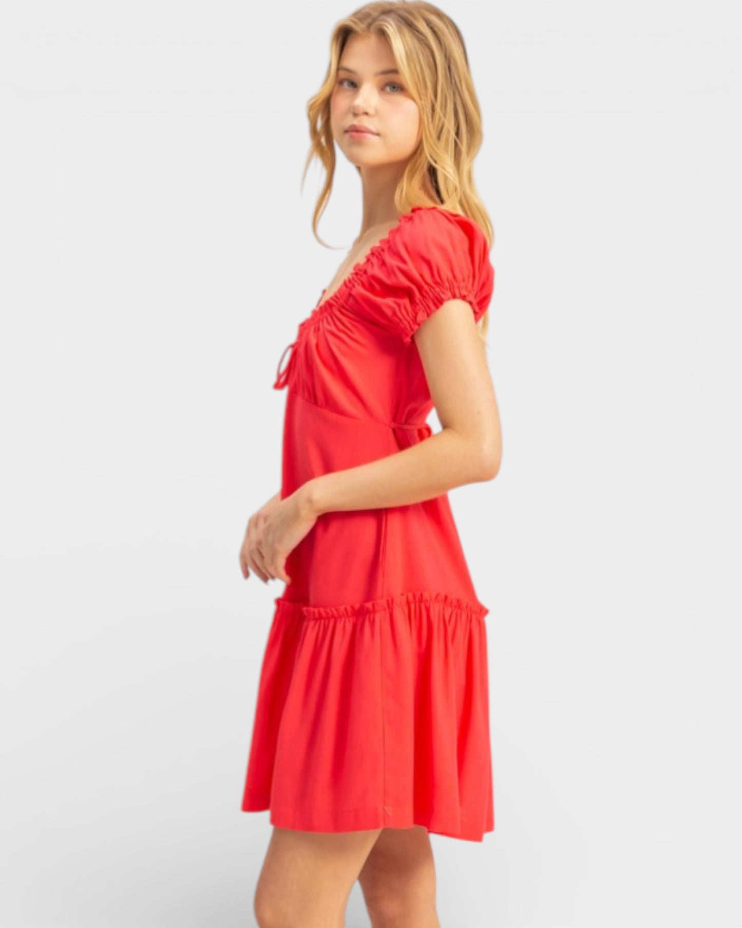 Woman wearing a red dress on a white background