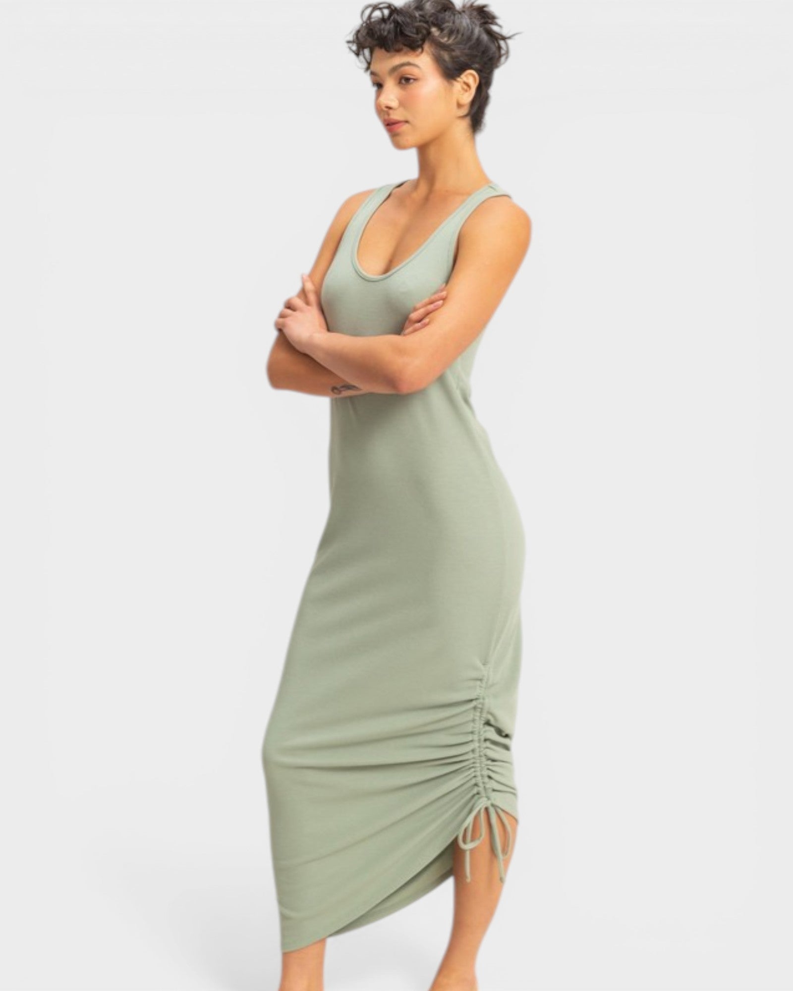 Woman wearing a green dress with a white background