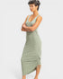 Woman wearing a green dress with a white background