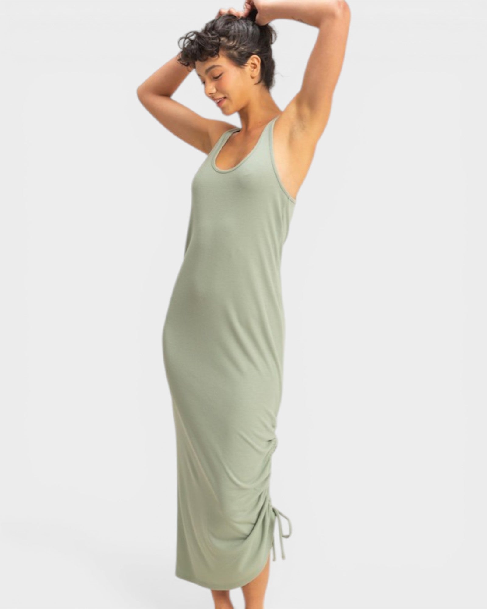 Woman wearing a green dress against a white background