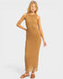 Woman wearing a brown crochet dress on a white background