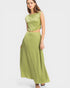 Woman wearing a green two-piece outfit on a white background