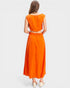 Woman wearing an orange dress on a white background
