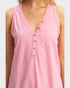 Pink sleeveless top with button details on a white background