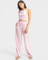 Woman wearing a pink outfit on a white background
