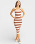 Woman wearing a brown and white striped dress on a white background