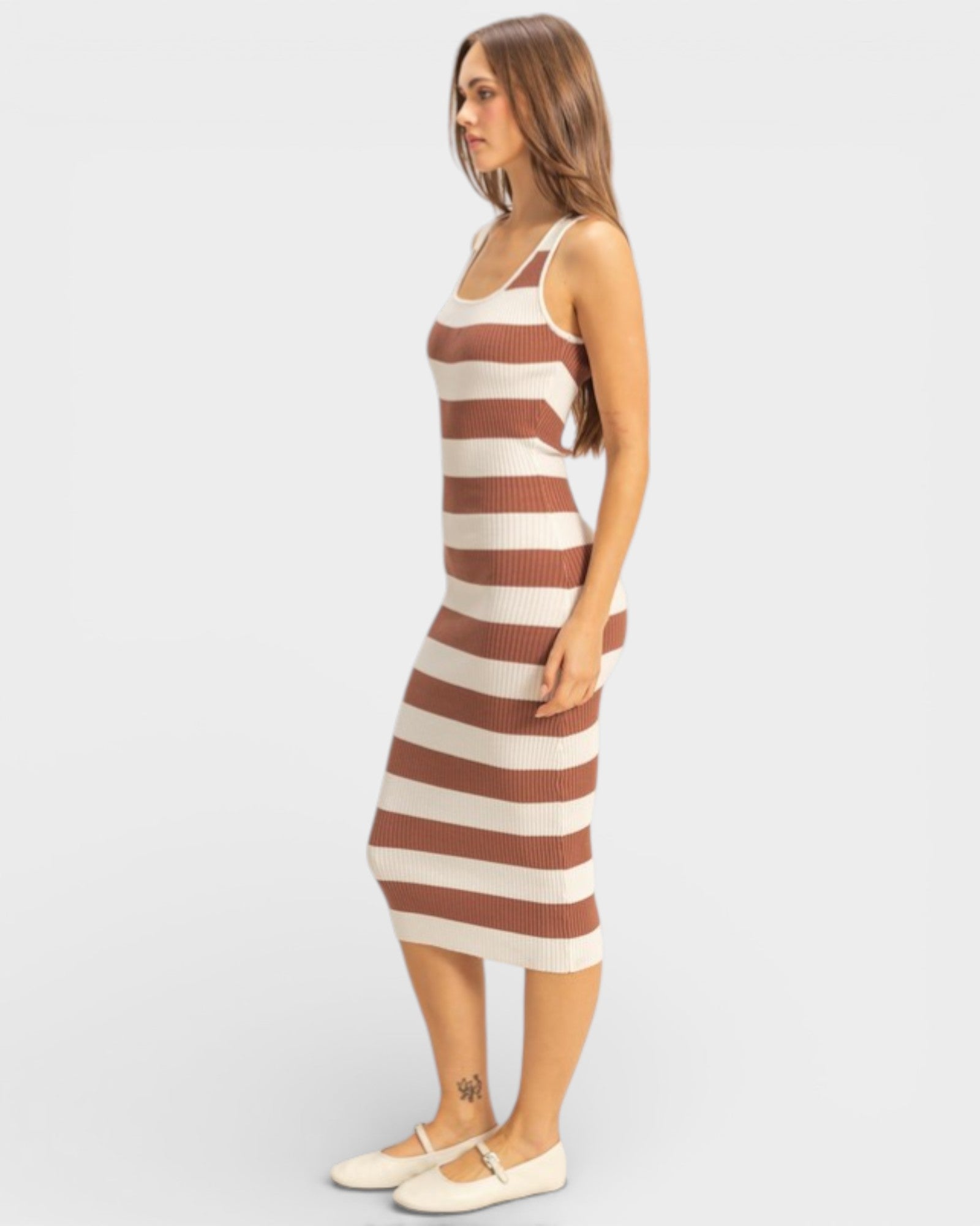 Woman wearing a striped dress on a white background