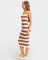 Woman wearing a striped dress on a white background