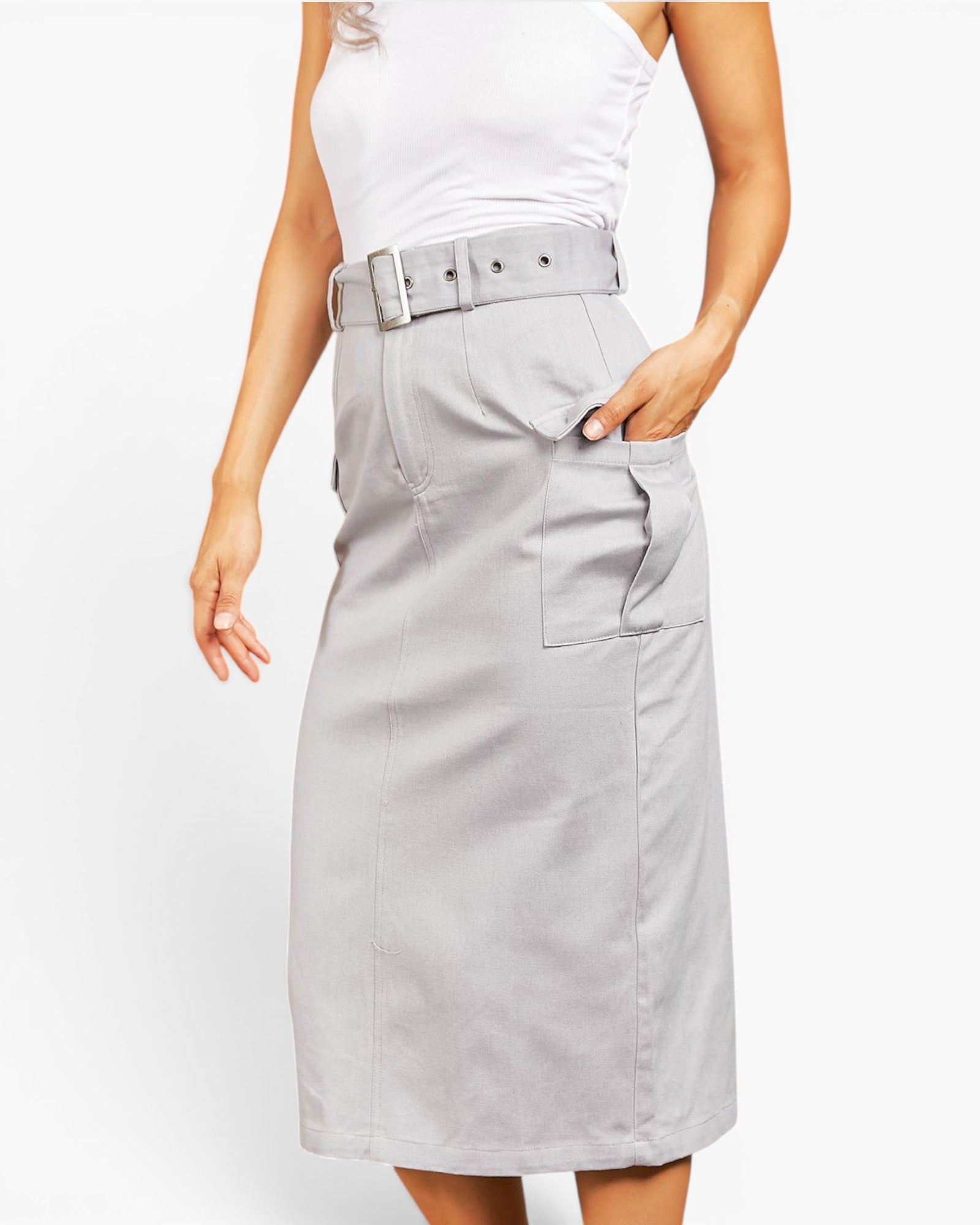 A model wearing a light gray high-waisted midi skirt with a matching belt and a white sleeveless top, shown against a plain white background.