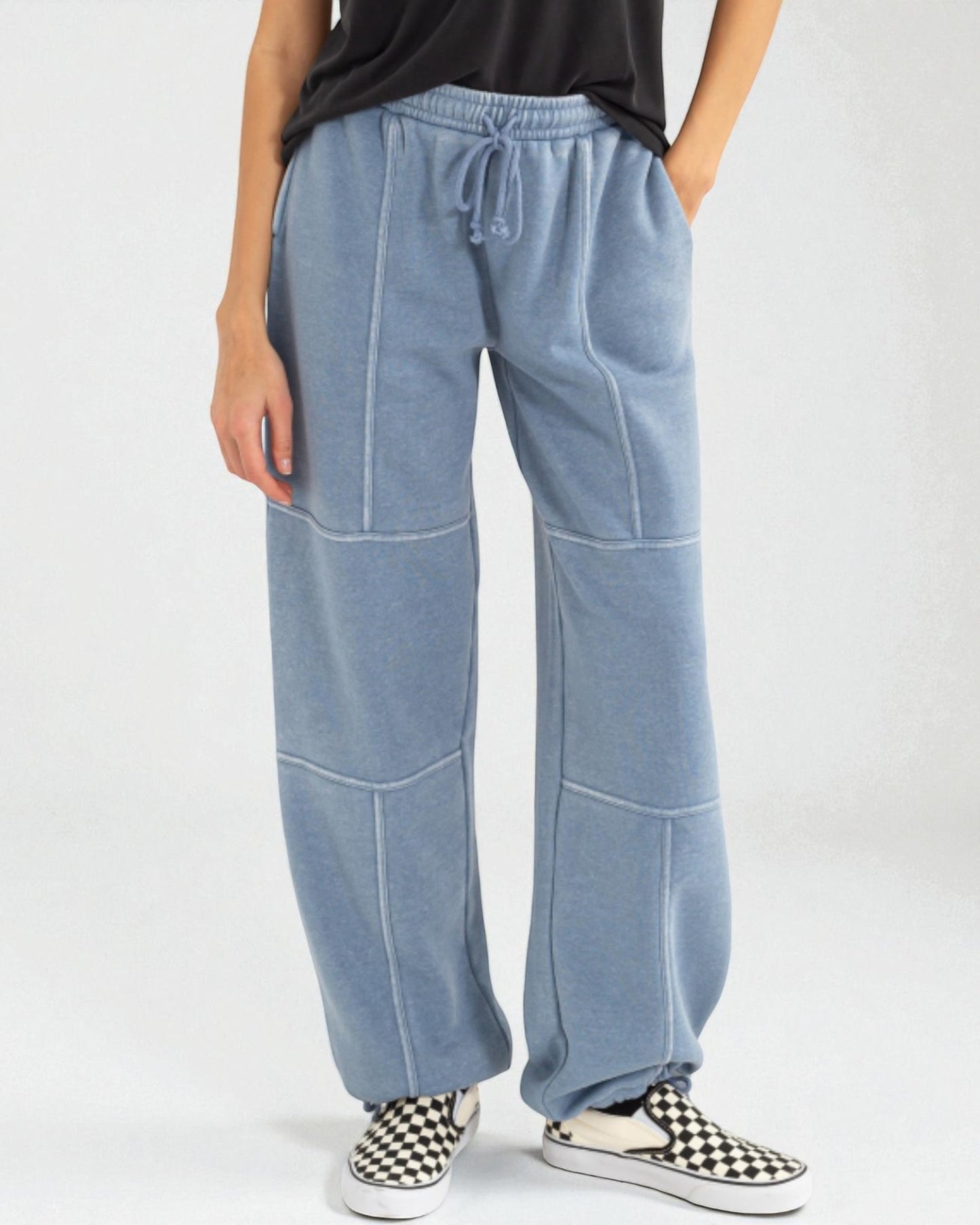 Light blue wide-leg pants worn by a person on a white background