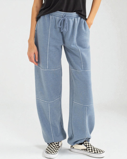 Light blue wide-leg pants worn by a person on a white background