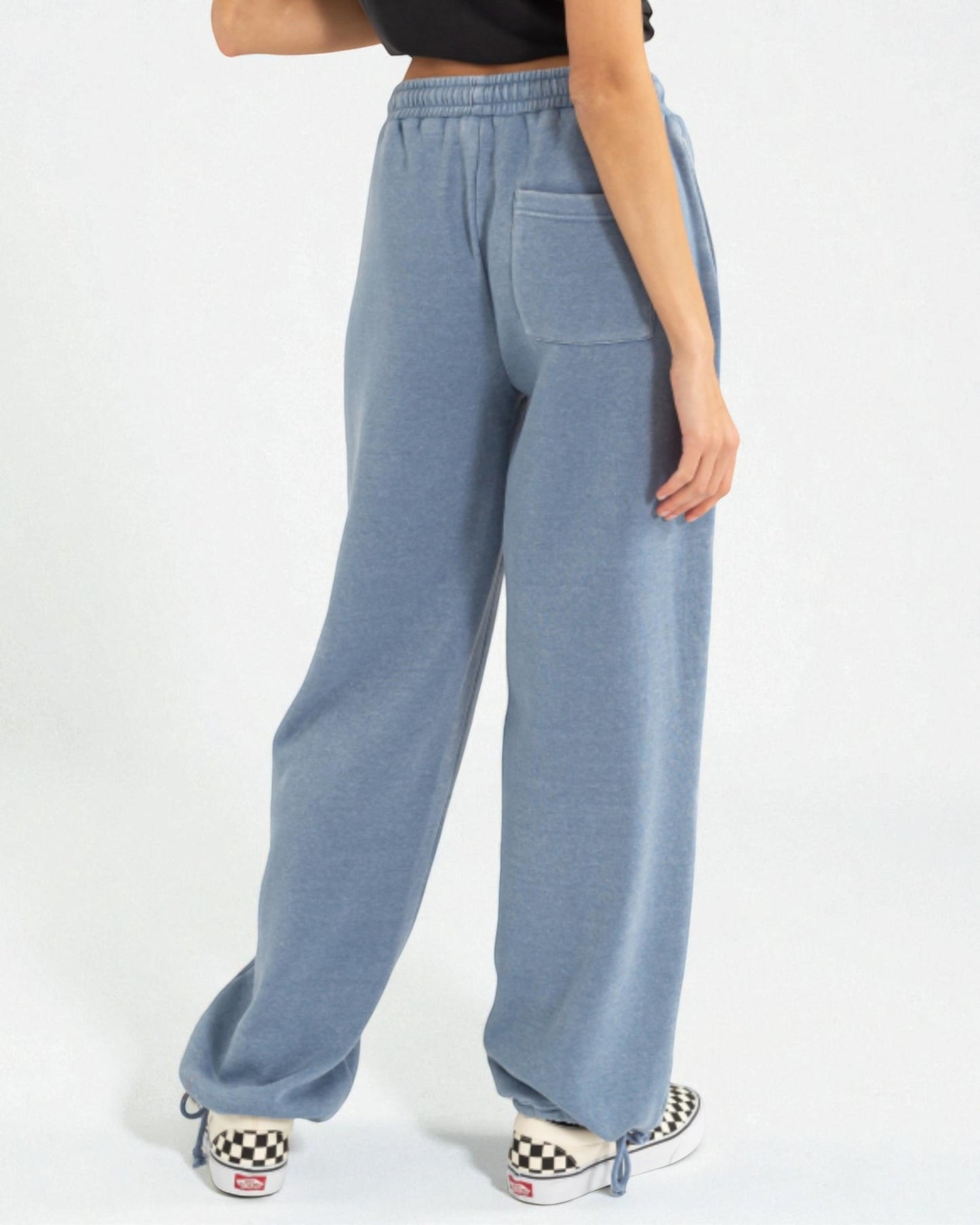 Light blue wide-leg pants worn by a person on a white background