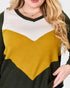 Color-blocked sweater with black, white, and mustard yellow sections.