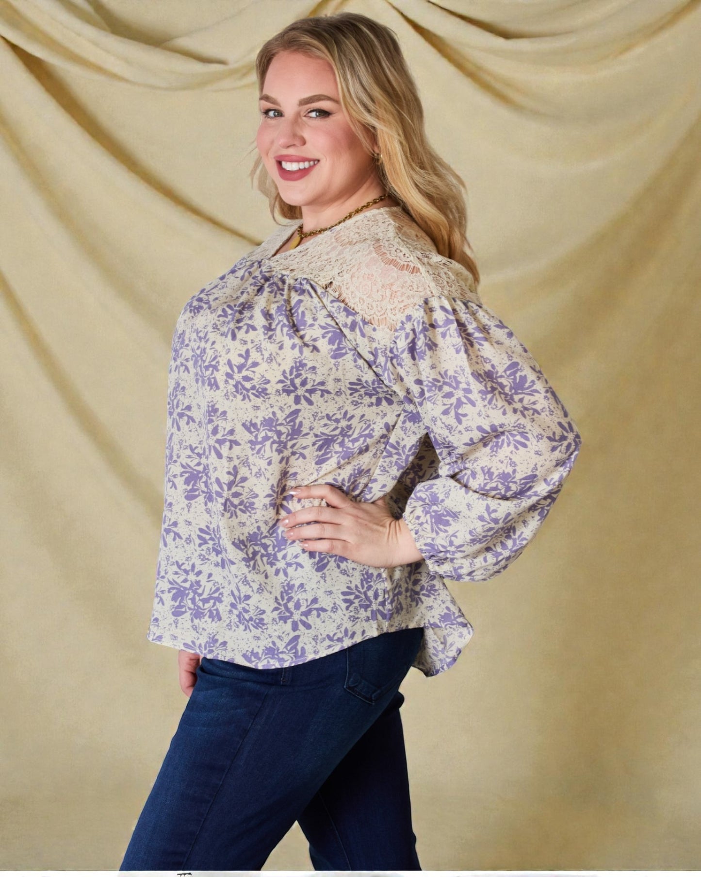 Woman wearing a floral blouse with a beige background