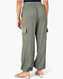A person shown from the back wearing loose, wide-leg cargo pants in a muted sage green color with a subtle vertical textured stripe pattern. The pants feature an elastic waistband, side cargo pockets, and a relaxed, comfortable fit, paired with beige block-heel sandals against a clean white background.