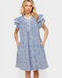 Woman wearing a blue checkered dress on a white background