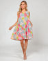 Woman wearing a colorful patterned dress on a white background