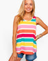 A woman wearing a colorful sleeveless tank top with horizontal stripes in yellow, pink, orange, teal, and white, paired with denim shorts, against a plain white background.