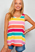 Woman wearing a colorful striped tank top against a plain background