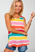 Woman wearing a colorful striped tank top against a plain background