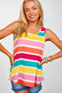 Woman wearing a colorful striped tank top against a plain background