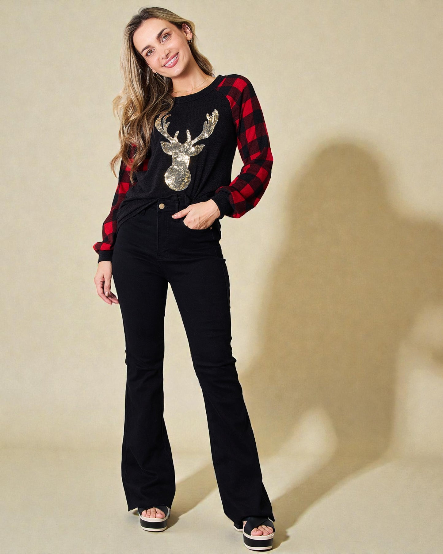 Haut à carreaux noir à motif de renne à sequins