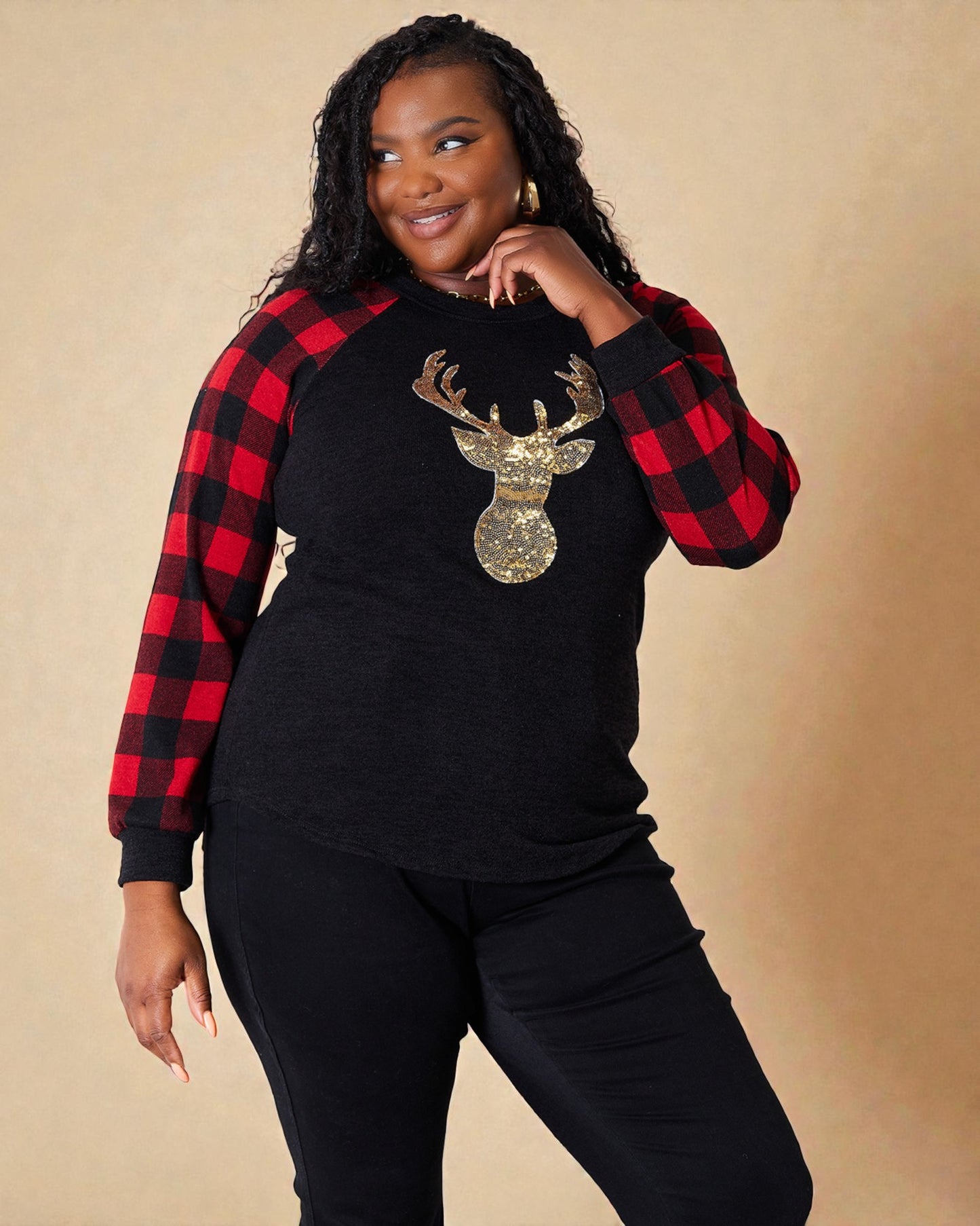 Haut à carreaux noir à motif de renne à sequins