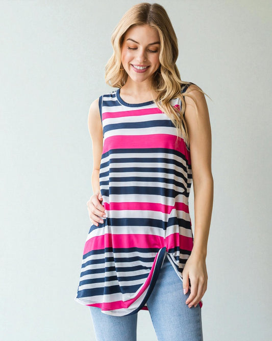 Woman wearing a sleeveless striped shirt with a plain background